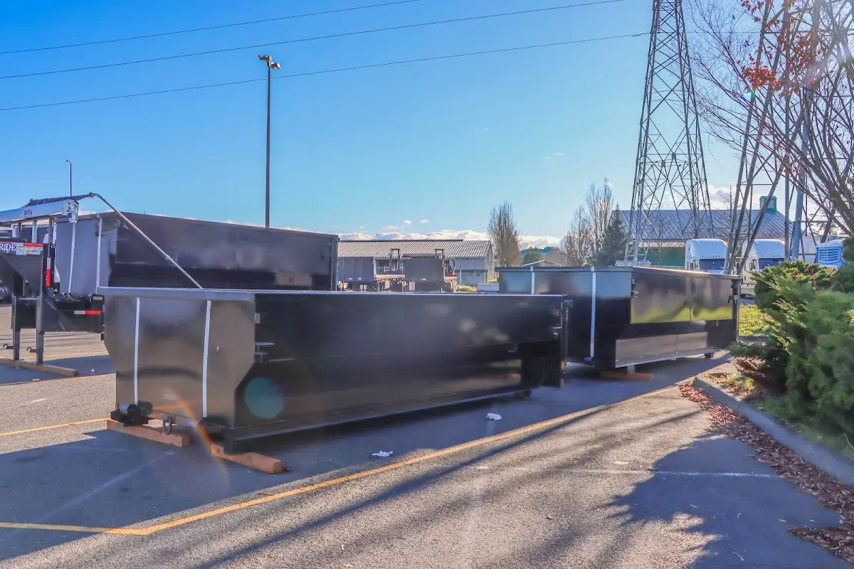 Roll-off dumpster ready for waste disposal at job site for 12 Yard Dumpster Rental in Merrill